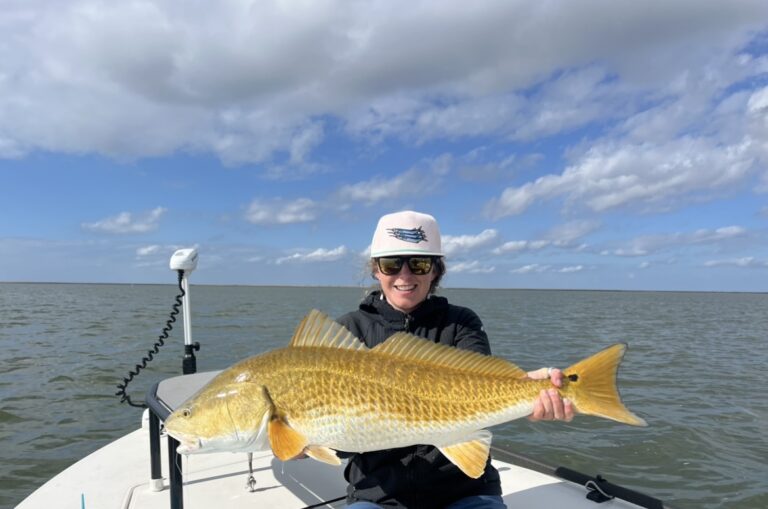 Woman holds fish in Venice, Louisiana